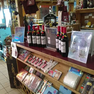 shelves of bottles of wine and cards