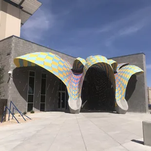 You can recognize the building from the road by the entrance.