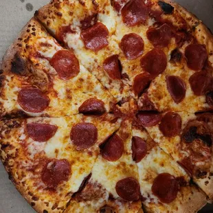 a pepperoni pizza in a box