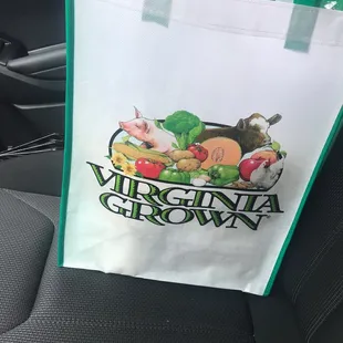 a grocery bag in the passenger seat of a car