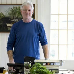 a man standing in front of a counter