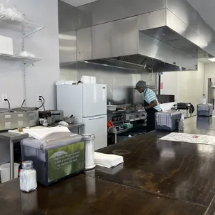 a man working in a commercial kitchen