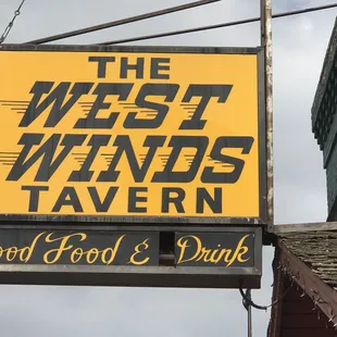 a sign for the westwinds tavern