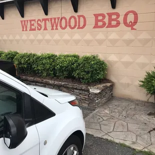 ows a car parked in front of a restaurant
