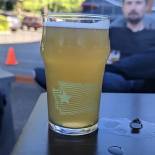 a glass of beer on a table