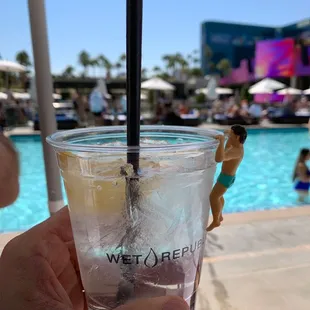 a person holding a drink