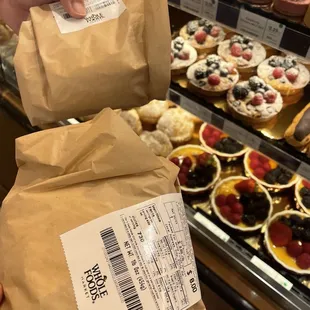 a person holding a bag of food