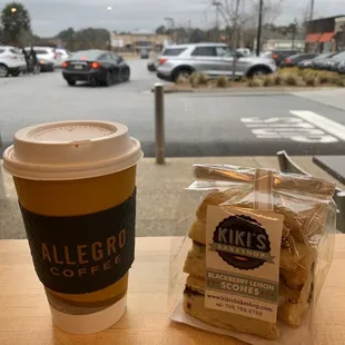 a cup of coffee and a bag of cookies