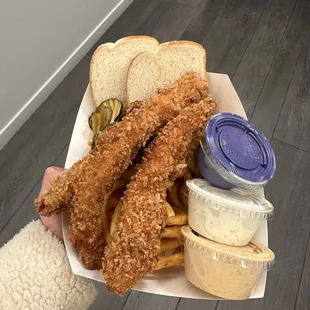 a person holding a basket of food
