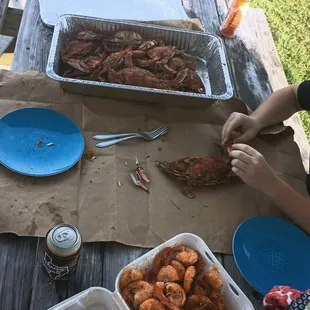 a picnic table full of seafood