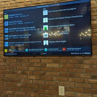 menus displayed on a brick wall