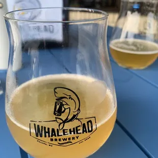 a glass of beer on a table