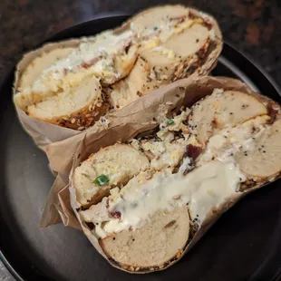 Everything bagel with scallion cream cheese, scrambled eggs, and bacon