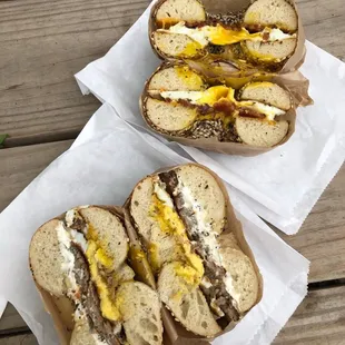 breakfast sandwiches! one with sausage, one with bacon. both on everything bagels