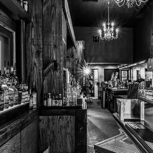 a black and white photo of a bar