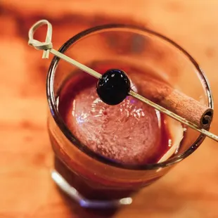 a drink with a stick in it