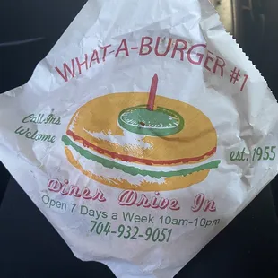 ows a sandwich wrapped in paper