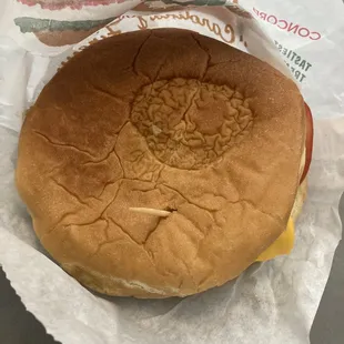 What-A-Burger added mustard. That mark n top is from a slice of pickle. Nothing special but better than McDonalds or BK.