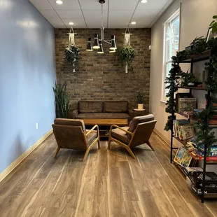 a living room with a couch and chairs