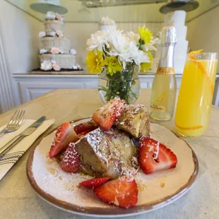 French Toast Pudding brioche baked perfection, apples, cinnamon, fresh strawberries, toasted, coconut &amp; maple syrup