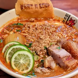 a bowl of soup with meat and vegetables
