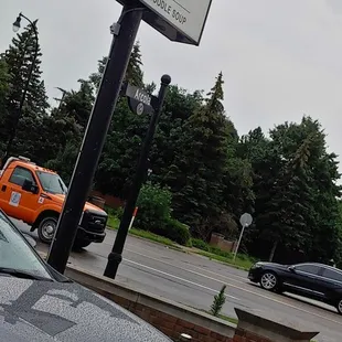 a car parked in front of a pharmacy