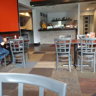 a man sitting at a table in a restaurant