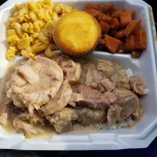 Smothered chops, yams, Mac n cheese, corn bread