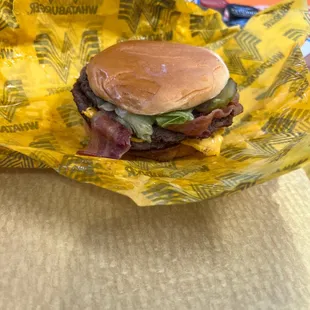 a hamburger in a wrapper