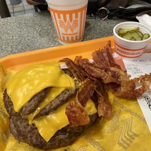 a hamburger with bacon and cheese