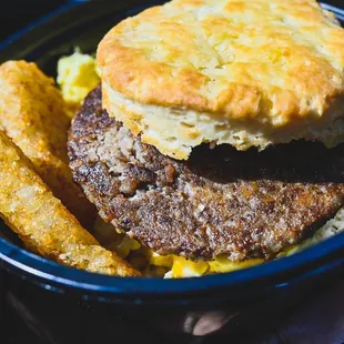 a plate of food with a biscuit on it