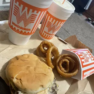 a hamburger and onion rings