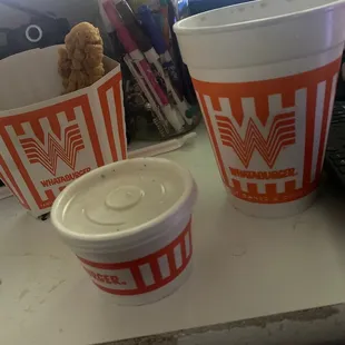 two cups of coffee on a desk