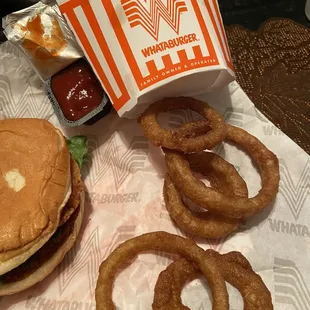 a hamburger and onion rings