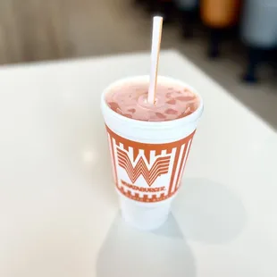 a smoothie in a paper cup