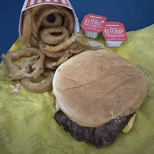 a hamburger and onion rings