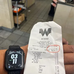 a receipt with a watch on it