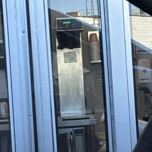 a view of a kitchen through a window