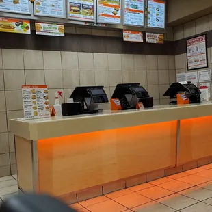 a restaurant counter and menus