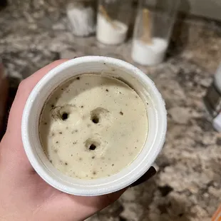 a person holding a cup of coffee
