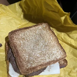 a toasted sandwich on a piece of paper