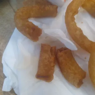 why does your staff put half the box with so many burnt pieces and no whole onion rings?