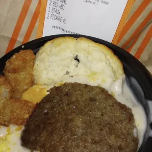 a hamburger, eggs, and hash browns