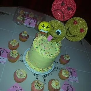 Emoji cake, with rainbow bread and edible emojis cupcakes.