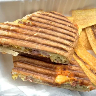 Breakfast Sidecar: omelet with smoked sausage, peppers and cheese on a Bread Box bun served with organic, locally made plantain chips