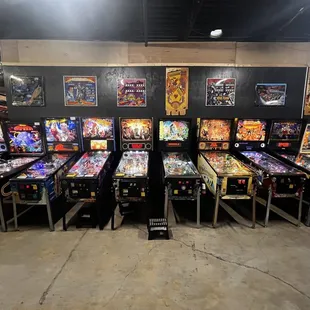 a row of pinball machines