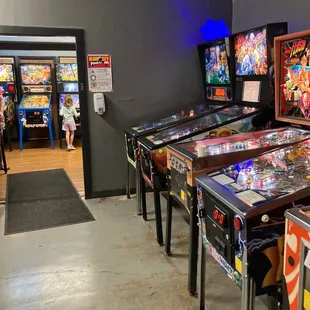 a row of pinball machines