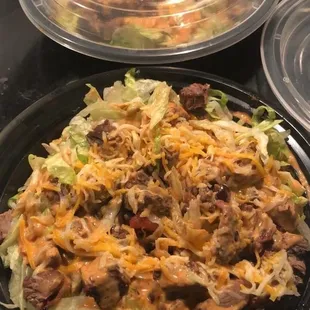 a plate of salad and a bowl of soup