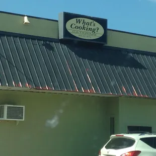 a car parked in front of a restaurant