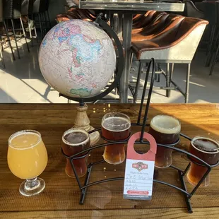 a globe and beer glasses